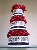 3%20tiered%20cake%20with%20red%20flowers