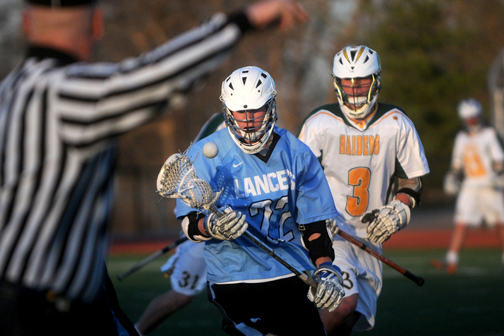 Peter Milledge takes the ball down the field in the Lancers' victory last week over SM South. Photo by Marisa Walton.