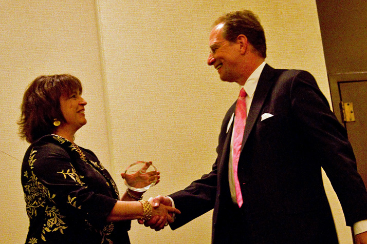 Northeast Johnson County Chamber of Commerce President and CEO Deb Settle congratulated Keith Krieger of Johnson County Community College at the Leadership Northeast graduation Thursday.
