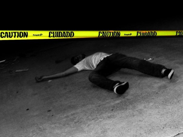 [Image: Dead_body_behind_caution_tape.jpg]