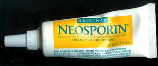 applying neosporin to open wound