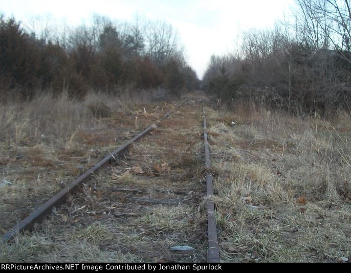 Ex-RI ROW, crossing hwy CC, looking east,