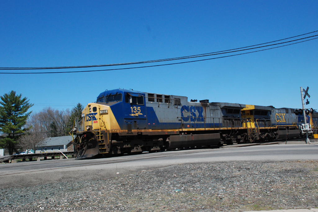 CSX 135 leads a coal train through town.