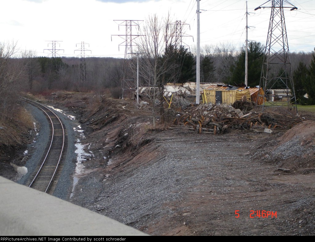 Freight Car's mangled alongside the Mainline