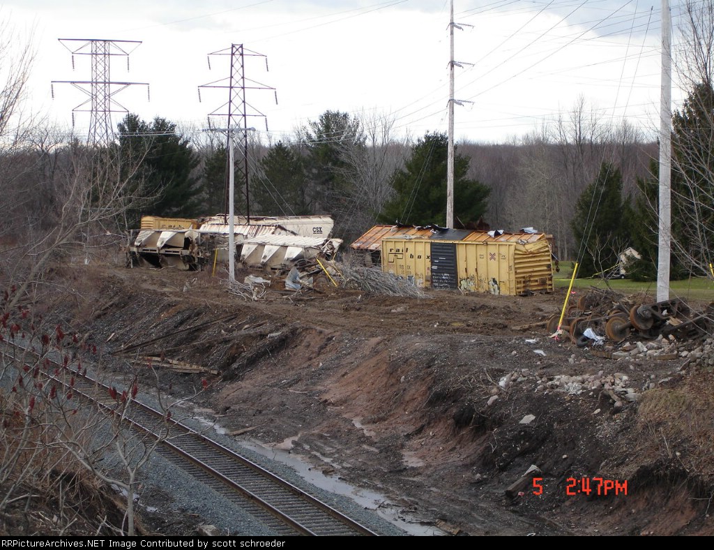Mangled Freight Car's off the side of the Mainline 
