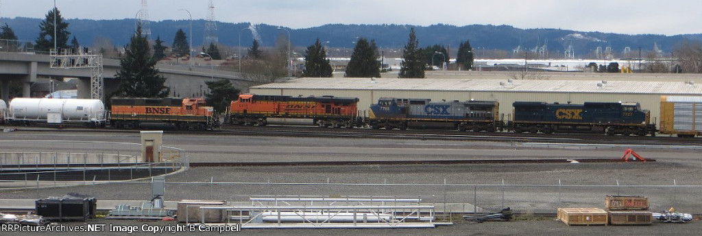 BNSF 6111 - CSX 7785 - CSX 7727 auto-rack on hold being passed (in reverse) by BNSF 2339 