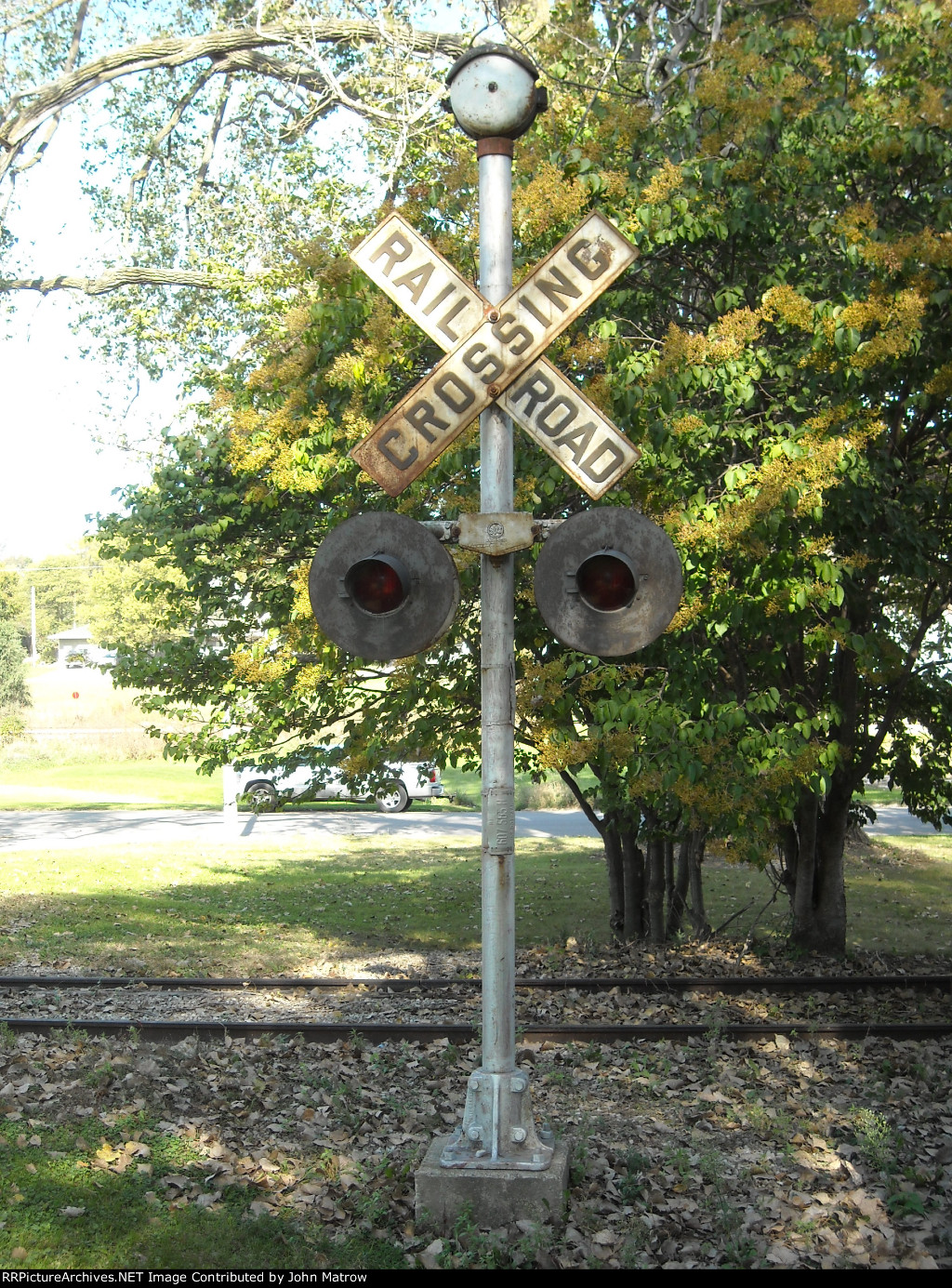 Old grade crossing crossbucks with bell