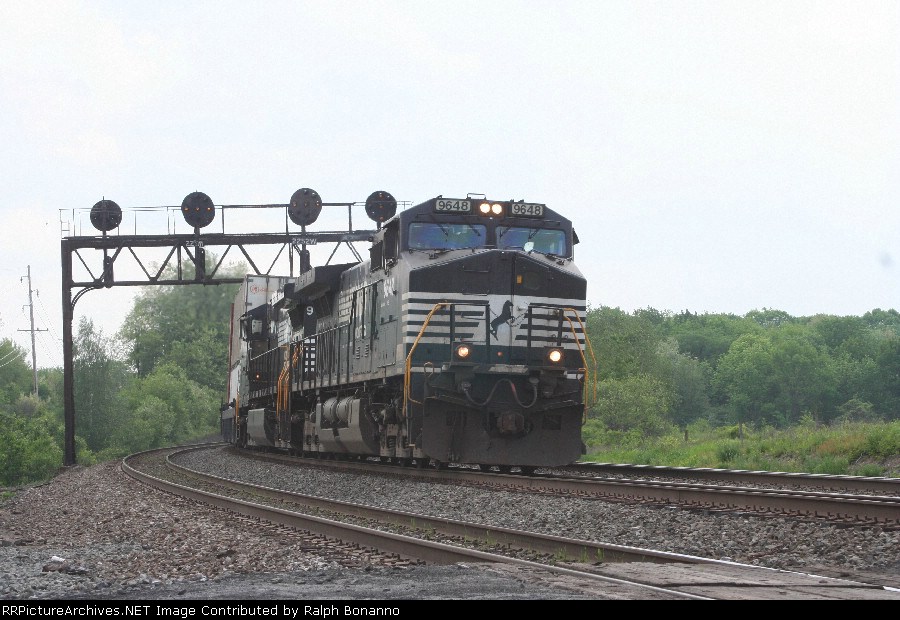 Eastbound 20Q rolls under a classic PRR signal bridge