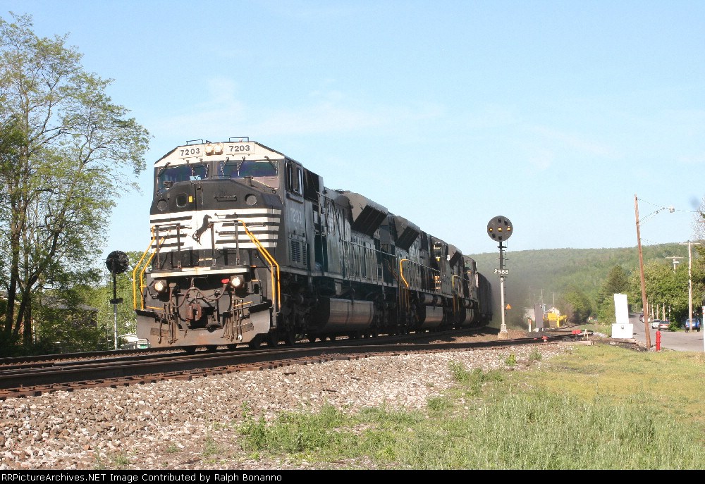 NS local C91 drifts downgrade toward South Fork. Note the coal dust by the signal post