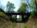 OLD WOODEN BRIDGE OVER ABANDONED NS TRACKS.