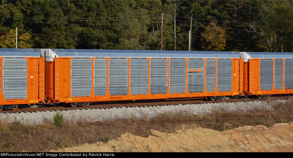 BNSF 301178 89-foot 4-inch flat car with BNSF 29158 Trinity auto rack in CSX Junta Yard freshly delivered from the nearby Trinity plant in Cartersville GA 5-27PM 11-03-2017