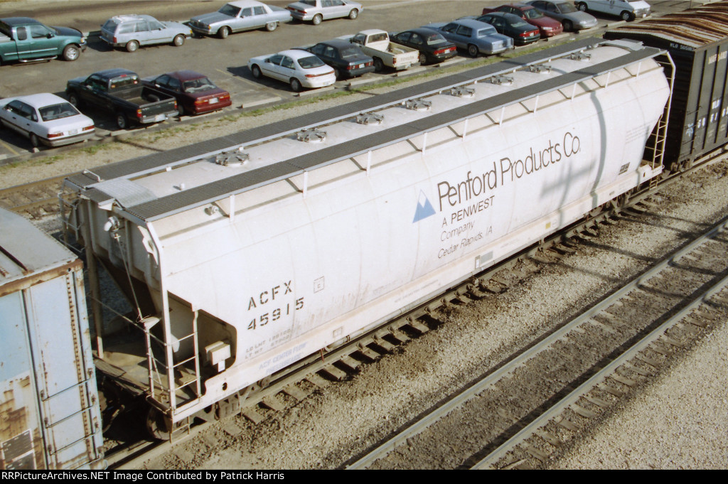ACFX 45915 5000cf 4-gate Penford Products ACF Pressureaid centerflow covered hopper in the IC-CN yard in Jackson MS 04-1999