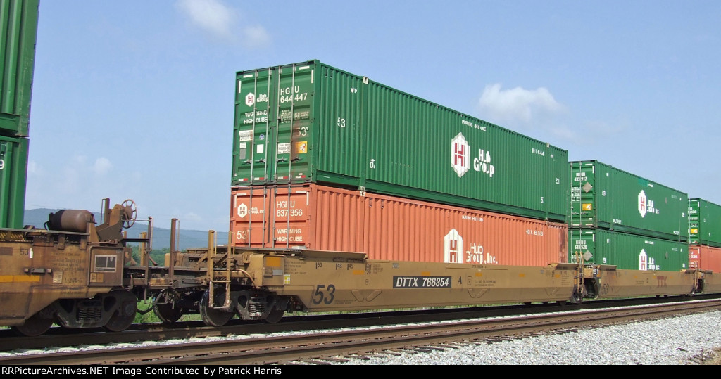 DTTX 766354A 53 well car with 2 53 Hub Group containers in green!and red northwestbound on the NS at Paint Rock AL 08-23-2014