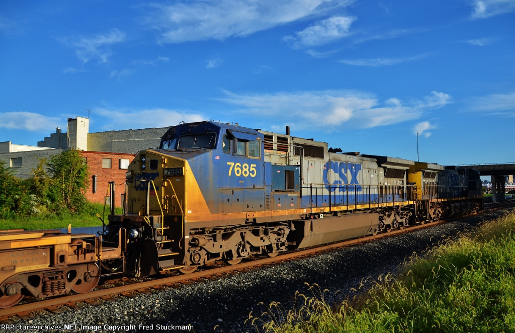 CSX 7685 helps and watches the train.