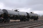 Two more of a long line of tank cars on the yard's north service track 