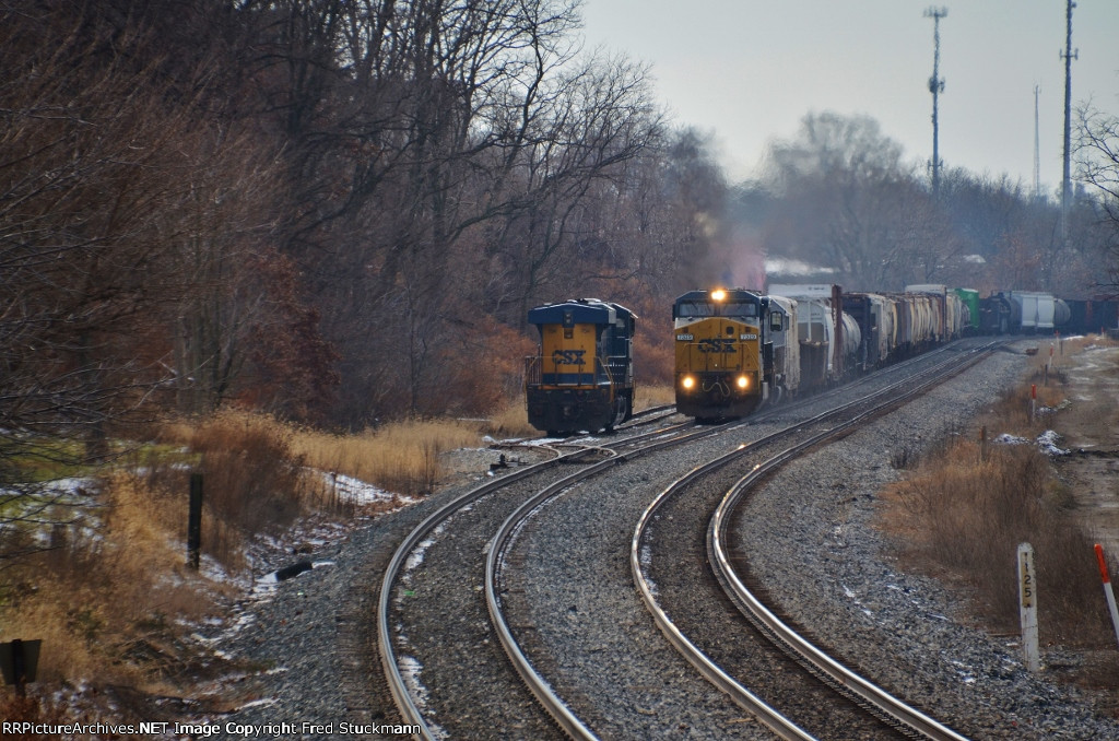 CSX 7329 pulls along side of her.