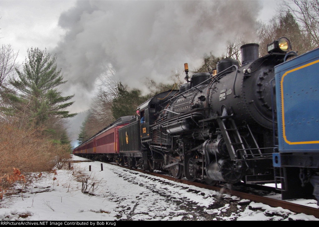 CNJ 113 is the trailing locomotive as the doubleheaded Santa train charges north