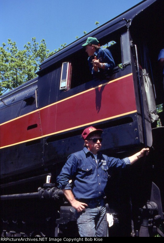 The crew was assisting people climbing into the cab