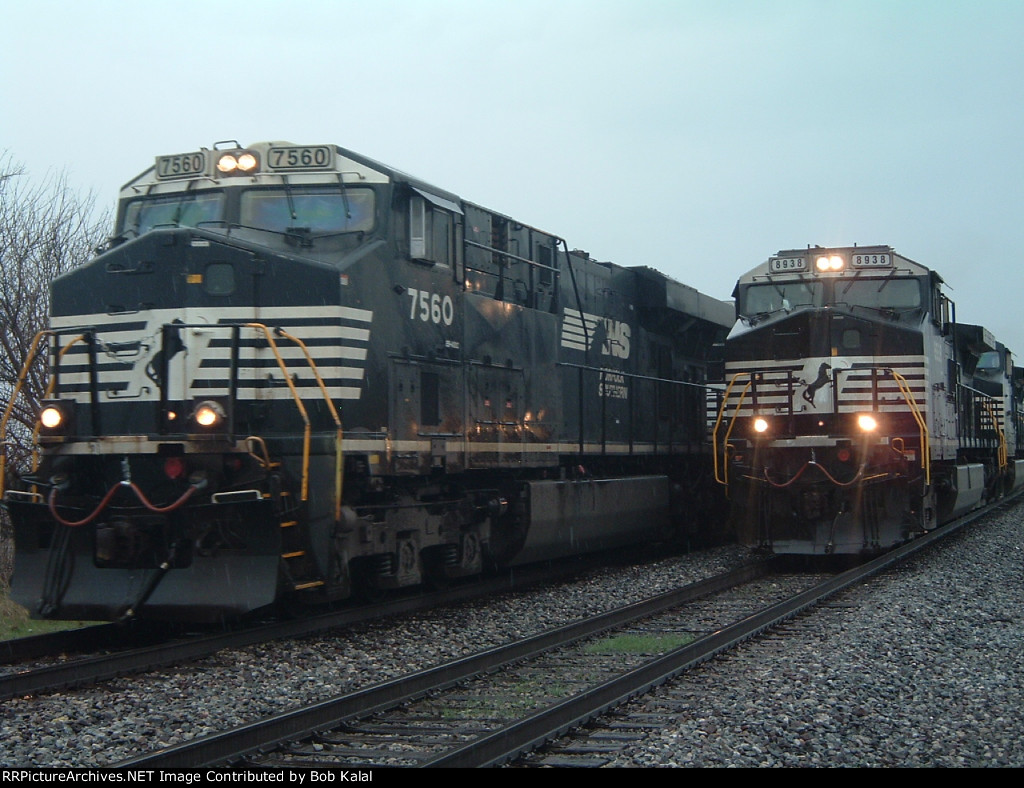 NS 8938 hooked to cars again waiting for other freight train NS 7560 to go by 