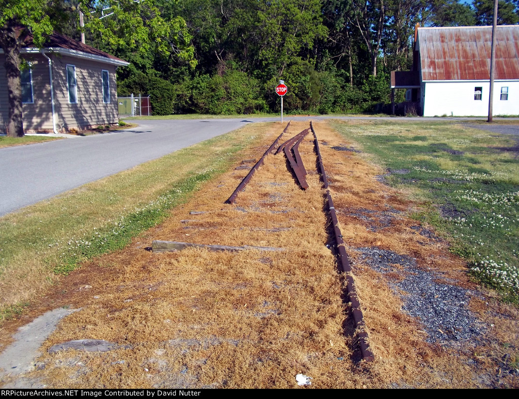 Some rip out of single rails lay on the ground, and look east and toward Salisbury