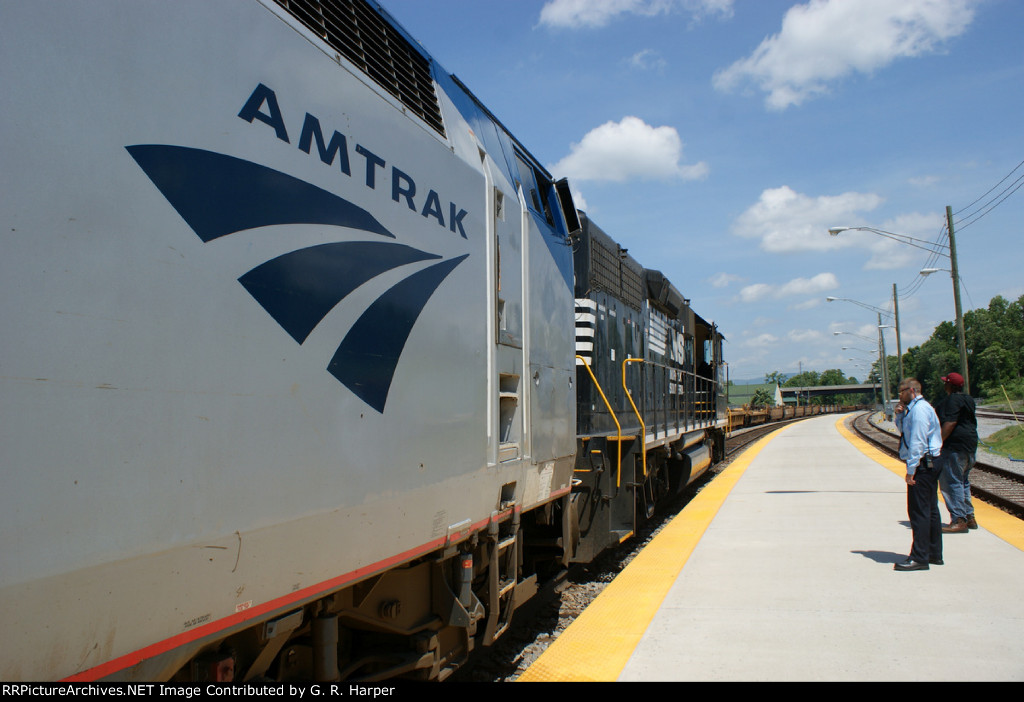 The NS unit and Amtrak unit and baretable train 24Q