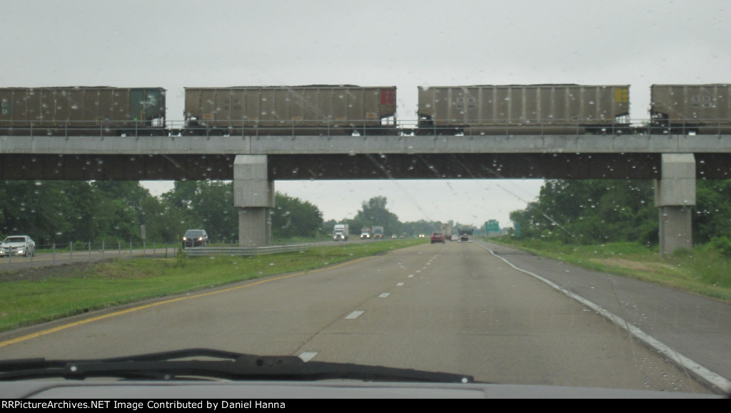 Loaded coal train stopped on bridge in Missouri