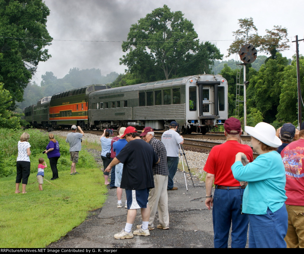 Onlookers disperse as the rear of the train passes