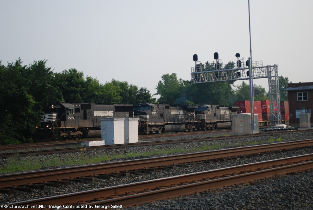 An SD70 takes doublestacks west.