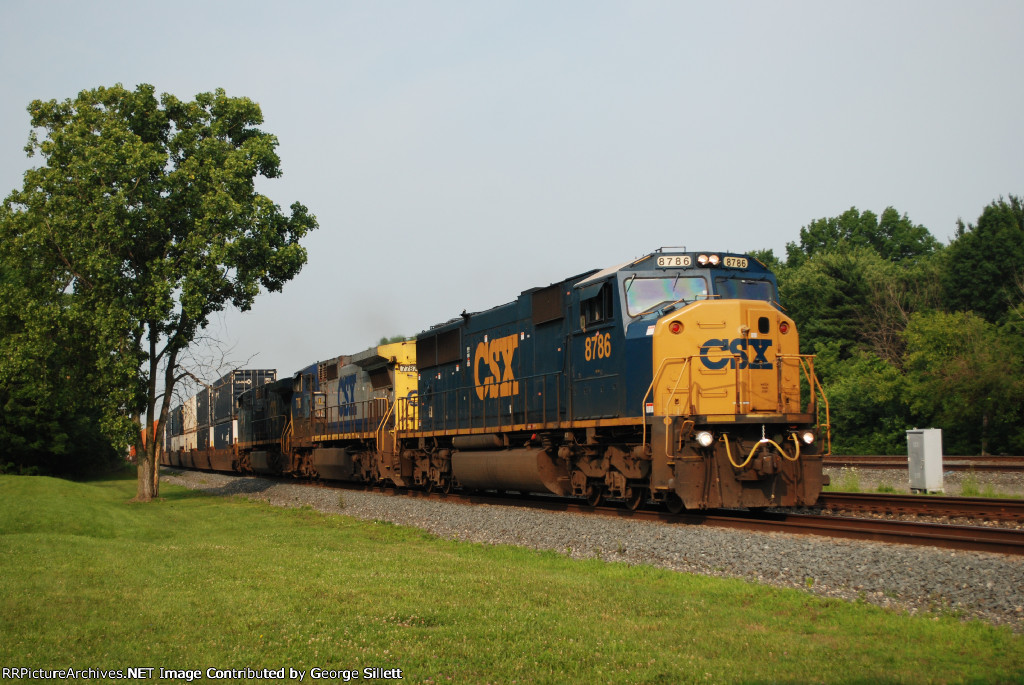 An ex conrail SD60I takes doublestacks east.