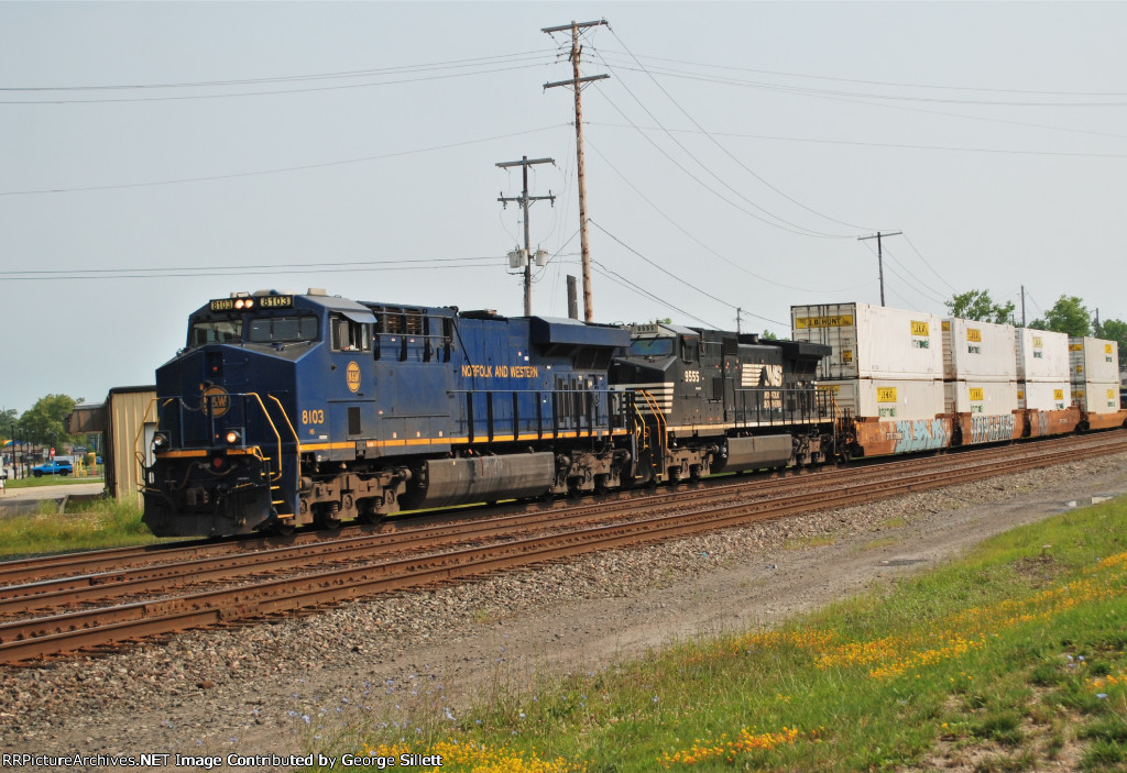 The N&W Heritage unit takes more doublestacks west.