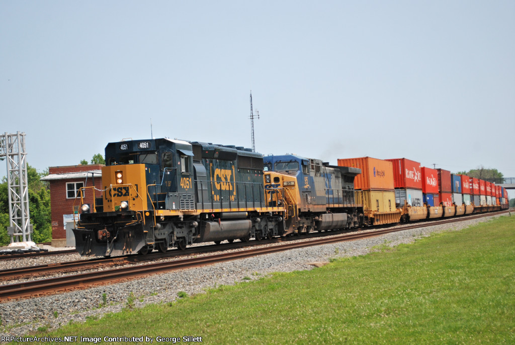 A CSX SD40-3 leads a train west.
