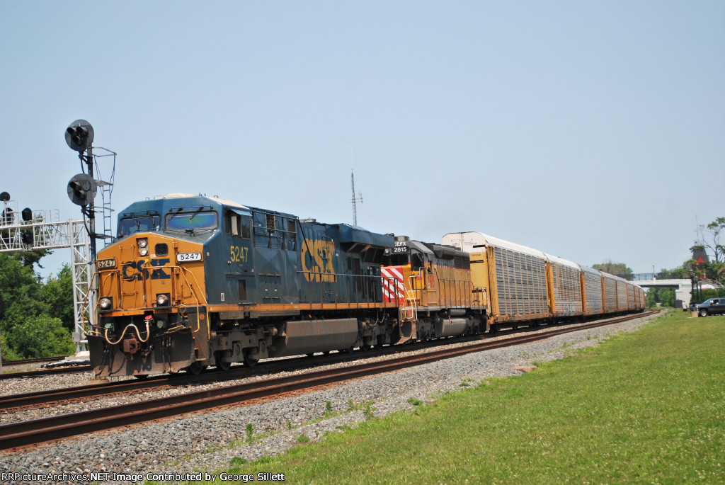 A CSX unit, and leaser heads west with autoracks.