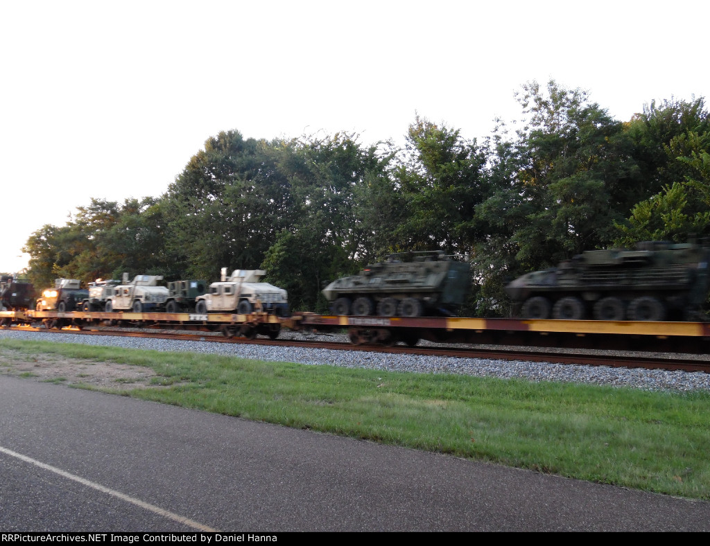 Military equipment rolls west on NS 053 