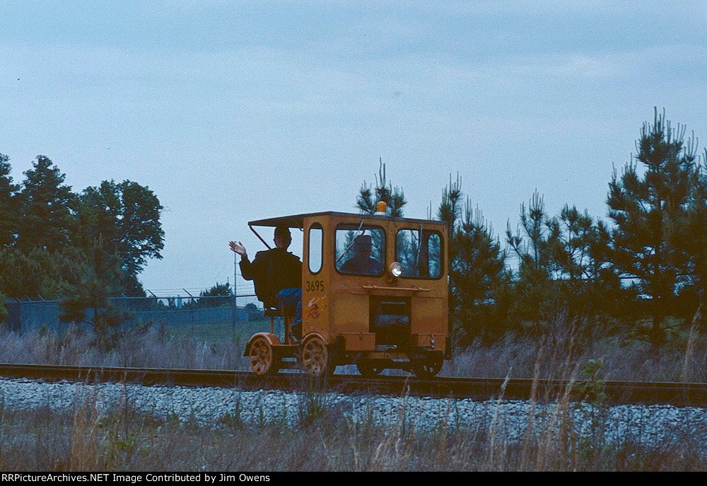 Motorcar riders out for a spin.