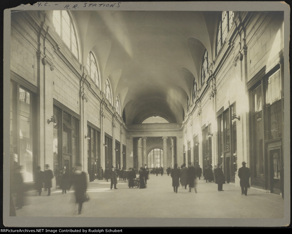 Passengers walking through hallway at Pennsylvania Station, New York, New York