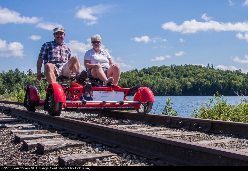 Pedaling our railbike westbound over the Lake Colby causeway