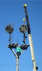 OFF WITH HIS HEAD! The first of two heads gets removed.