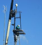 More sparks fly from the cutting torch as the ladder is cut