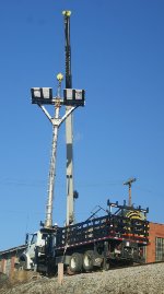 Headless signal mast lifted off its pedestal