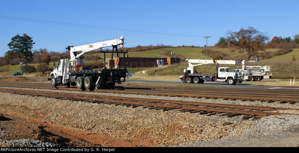 Hi-rail cranes are preparing to position themselves to remove old southbound signls at Hurt, VA.