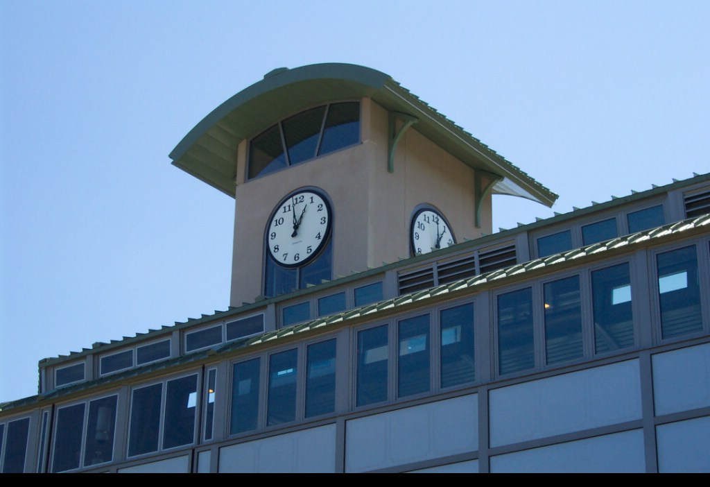 View of the clock tower over the pedestrian footbridge