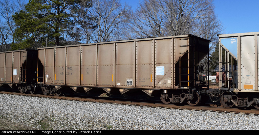 HBWX 99346 02-2000 built Trinity 4418cf Exceeds Plate F 8-gate rapid-discharge hopper eastbound and loaded on NS by Sectionline Street in Gurley AL 2:21PM 01-18-2015