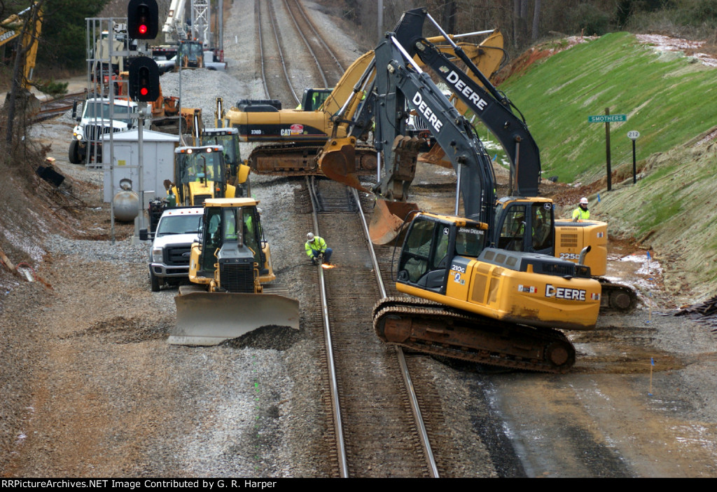 As soon a track time was given a hoard men and heavy machinery descended upon the right-of-way.