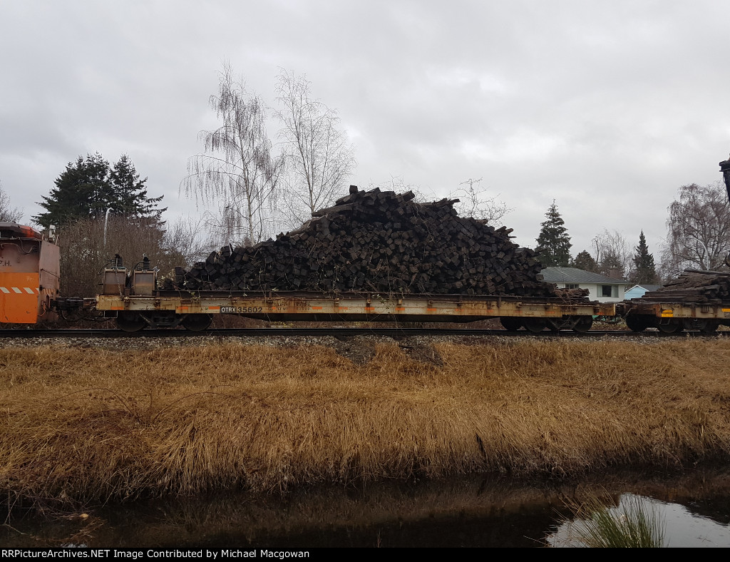 OTRX 35602 with pile of old ties