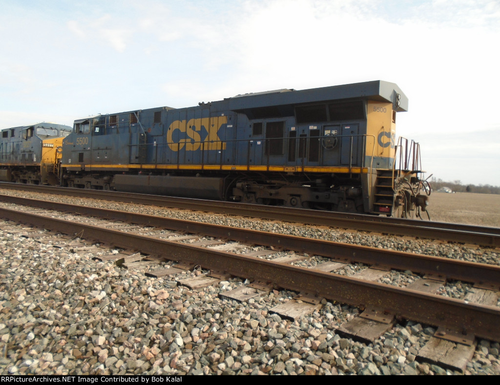 Further west, across N. Coles Street. CSX 5500 waiting