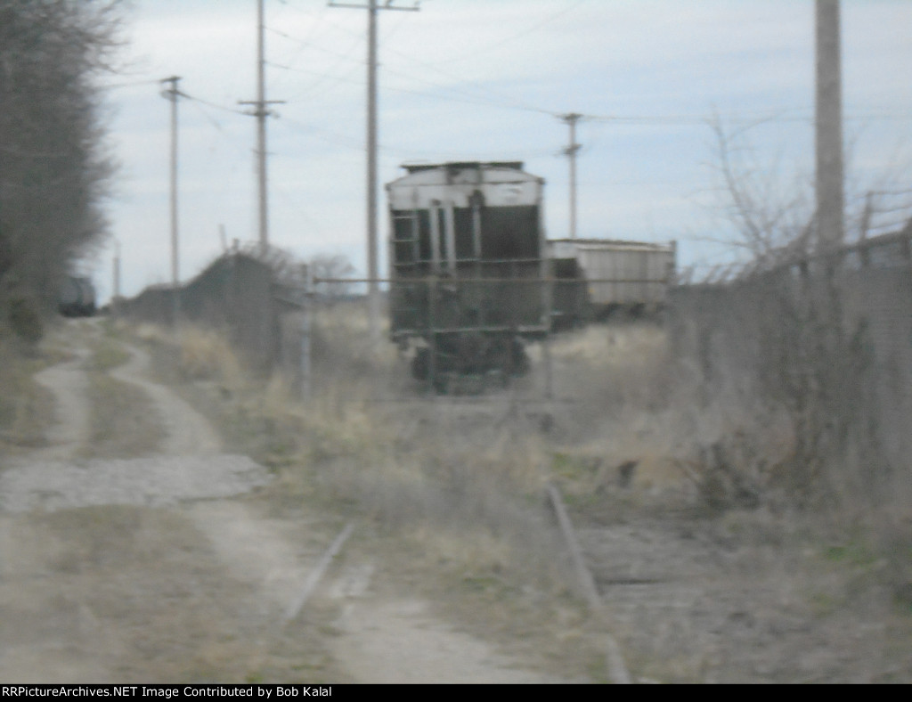  1 of 2 Hoppers trapped inside fence of Abandond Trailermobile Factory