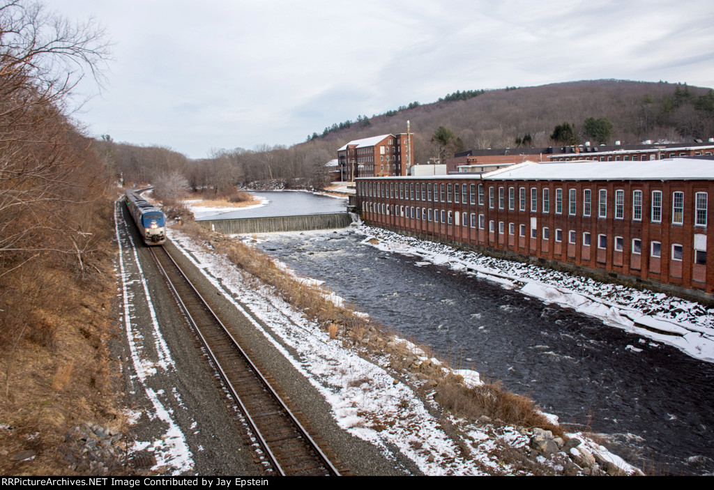 The Lake Shore Limited cruises cruises past the old mill 