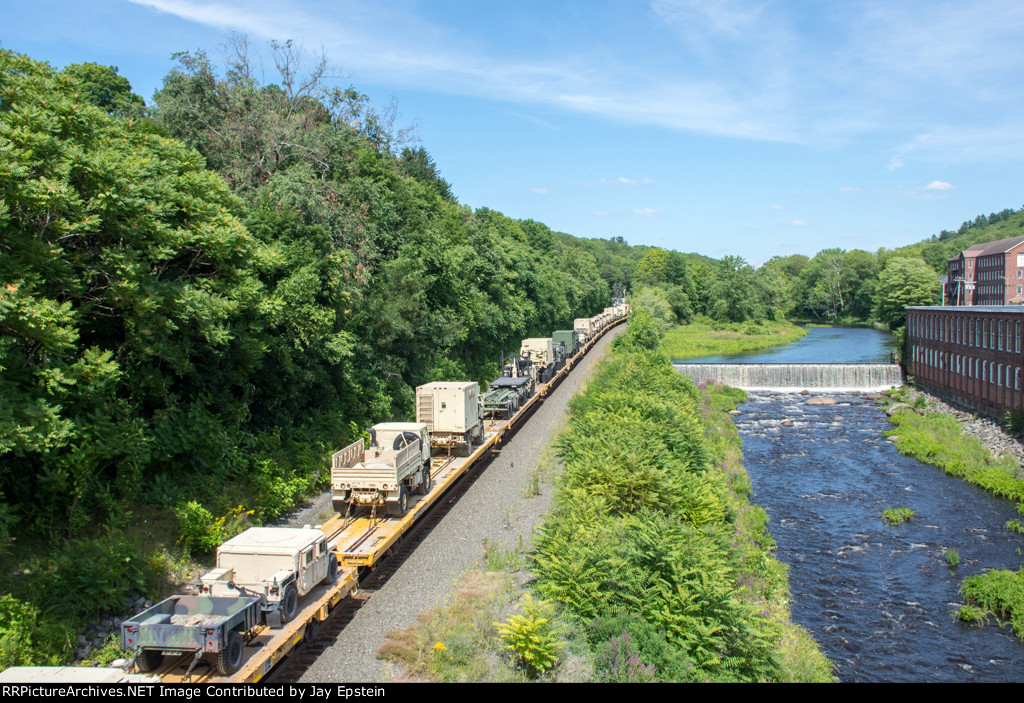 Military loads glide along the Quabog River