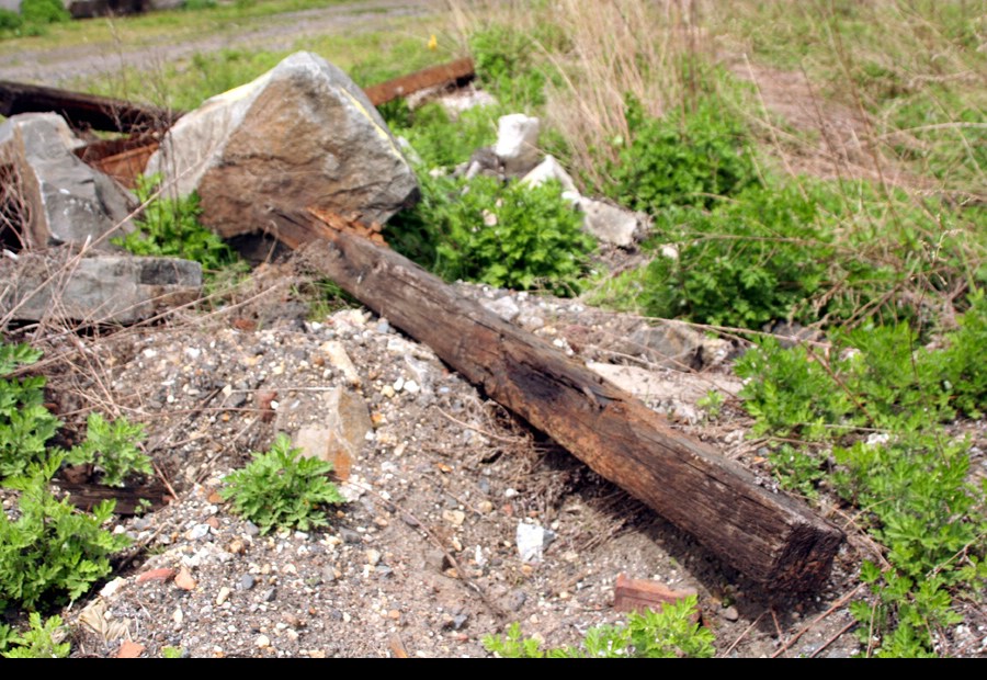 Old tie with plate still on it. This will never have a train on it again.