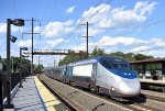 Westbound Amtrak Acela passing Metropark Station